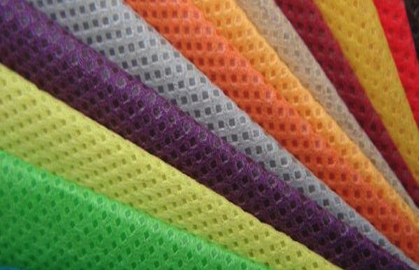 Best Fabrics for Custom Tote Bags. Close-up image of non-woven polypropylene fabric.